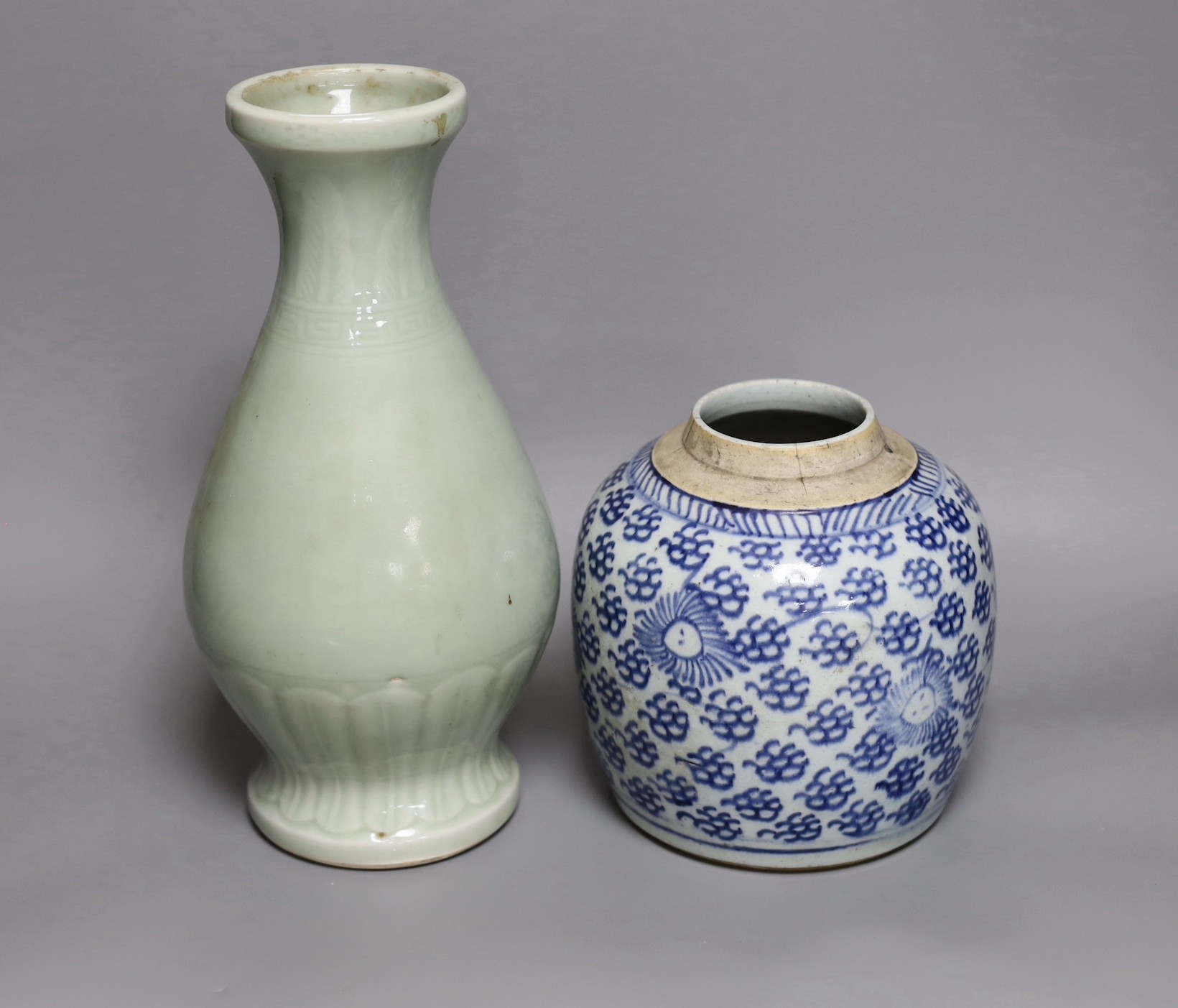 A Chinese celadon ground vase and a similar blue and white jar, tallest 30cm